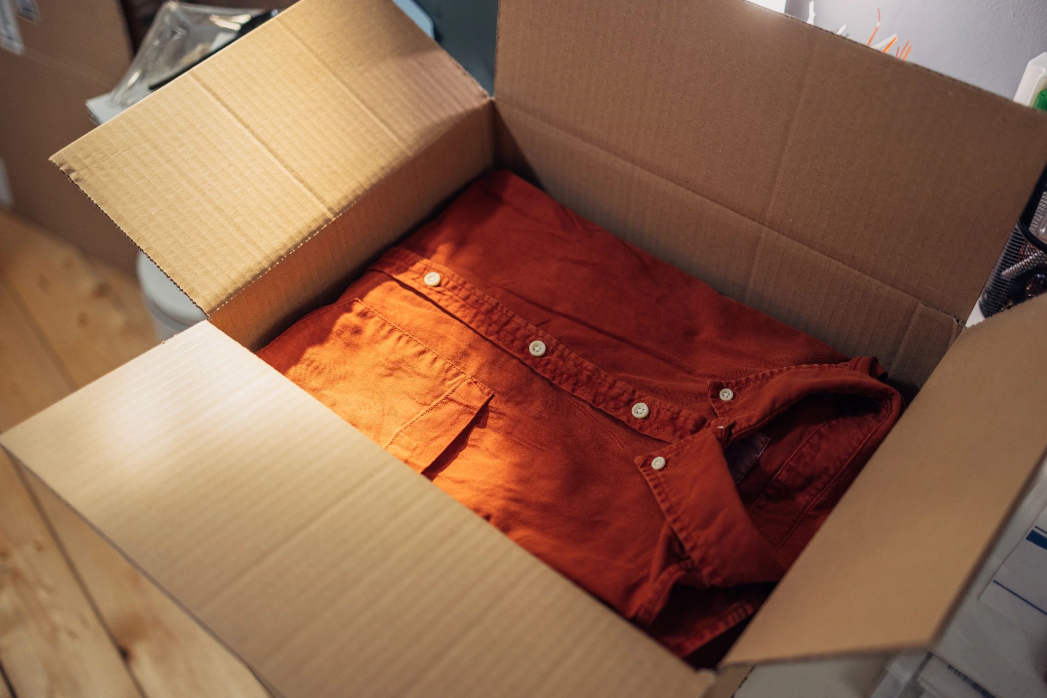 Clothing carefully packed in a shipping box