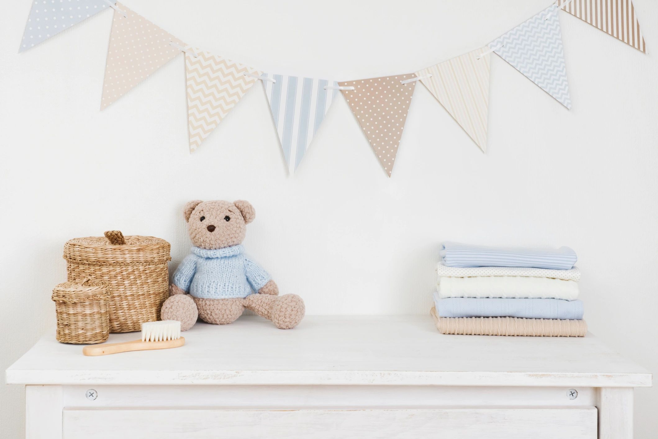 Baby goods and essentials arranged in a styled room